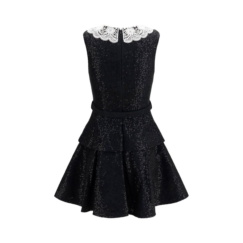 Self-Portrait black polyester casual dress displayed on a model, featuring a sleek, relaxed fit and minimalist design.