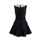 Self-Portrait black polyester casual dress displayed on a model, featuring a sleek, relaxed fit and minimalist design.
