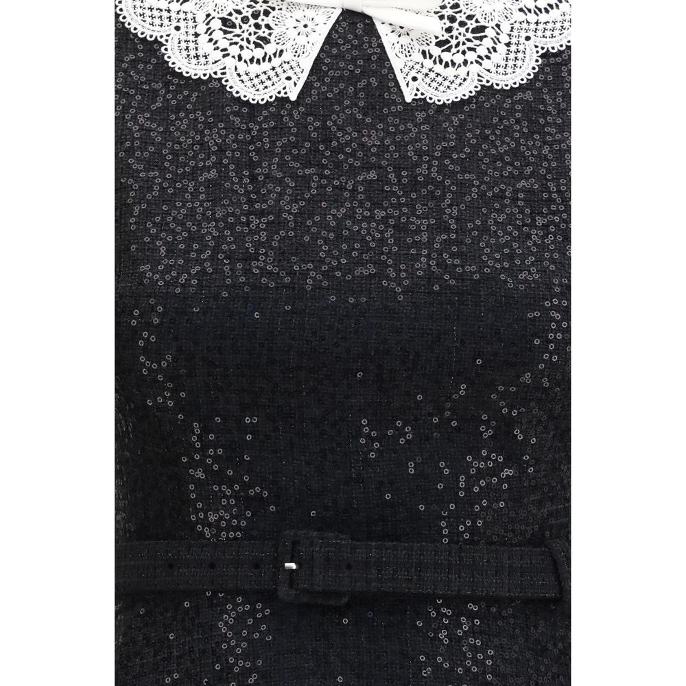 Self-Portrait black polyester casual dress displayed on a mannequin, showcasing its elegant and simple design.