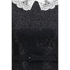 Self-Portrait black polyester casual dress displayed on a mannequin, showcasing its elegant and simple design.