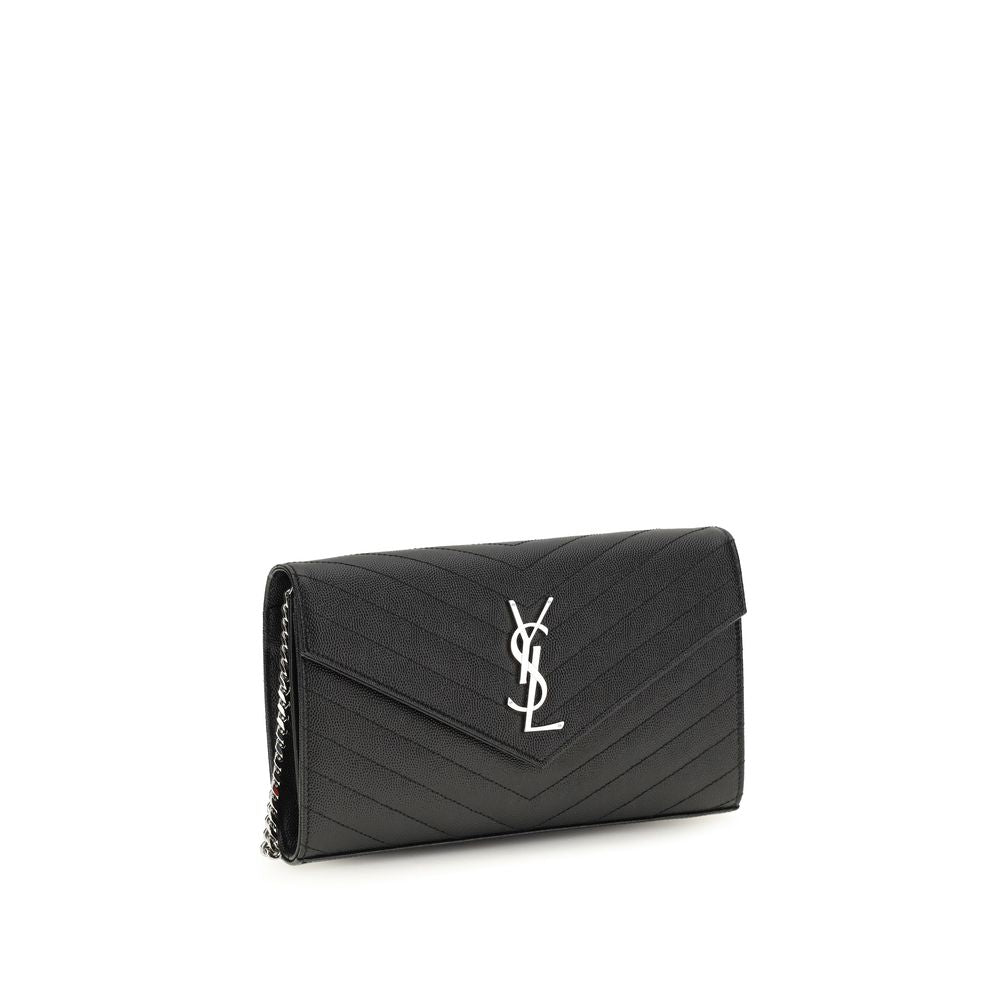 Saint Laurent Bos Taurus wallet in black calf leather, featuring sleek design and gold-tone hardware on a neutral background.