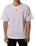 White Dolce & Gabbana metal DG logo short sleeve T-shirt with crew neck and classic fit, displayed flat on a neutral background.