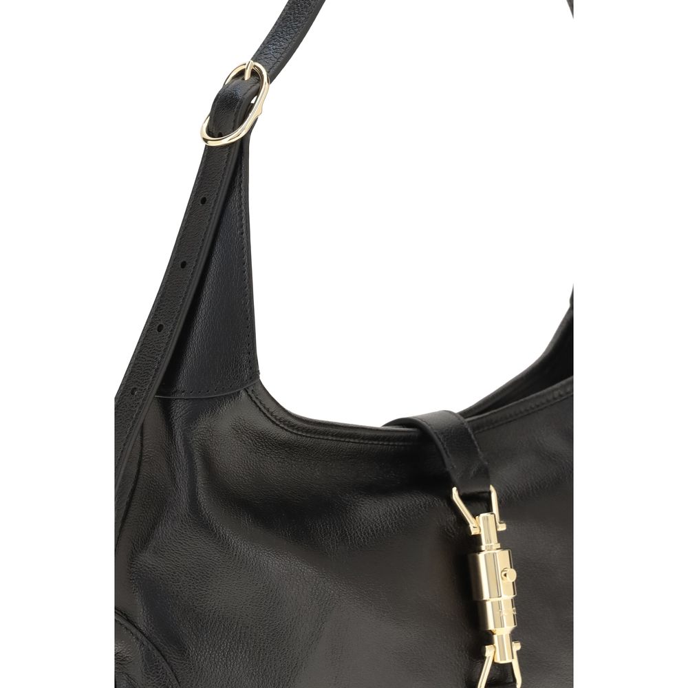 Gucci black goatskin shoulder bag with silver hardware, featuring a sleek design and adjustable strap.