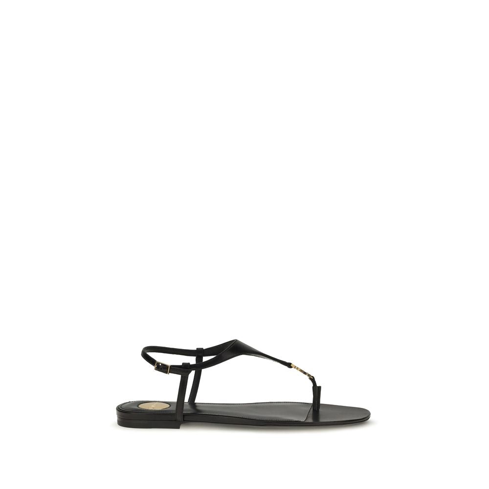Saint Laurent black calf leather Bos Taurus flat sandals showcasing sleek design and minimalist style.