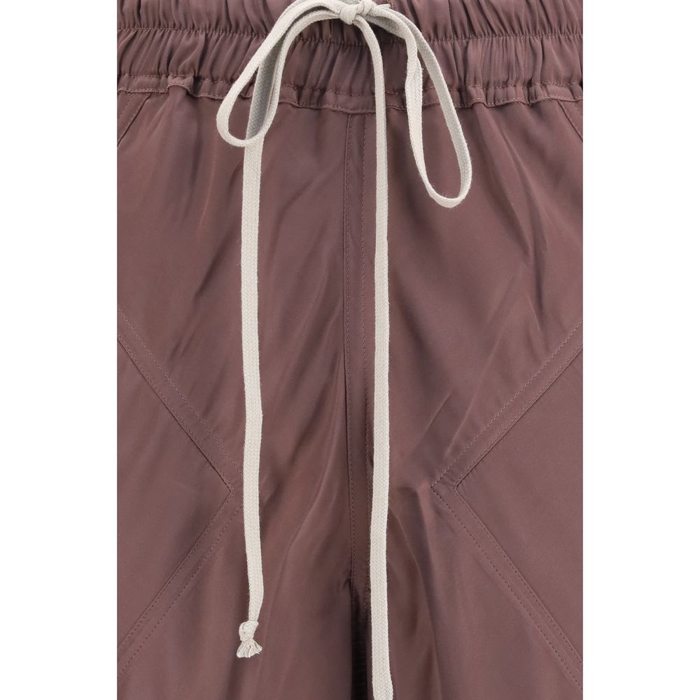 Rick Owens brown silk casual pants displayed on a hanger, showcasing their relaxed fit and smooth fabric.