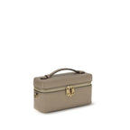 Gray Tory Burch Bos Taurus wallet made of calf leather with a sleek, compact design and subtle logo detailing.