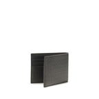 Ferragamo black calf leather Bos Taurus wallet with sleek design and multiple card slots on white background.