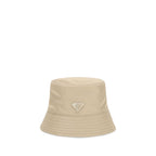 Prada beige polyamide bucket hat with wide brim and adjustable chin strap, stylish men's accessory.