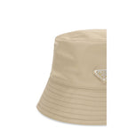 Prada beige polyamide bucket hat with wide brim and adjustable chin strap, stylish accessory for sun protection.