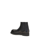Black calf leather MM6 Bos Taurus Chelsea boots with elastic side panels and sleek design.