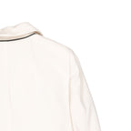 Brunello Cucinelli white virgin wool blazer displayed on a hanger, tailored with a classic lapel and sleek design.
