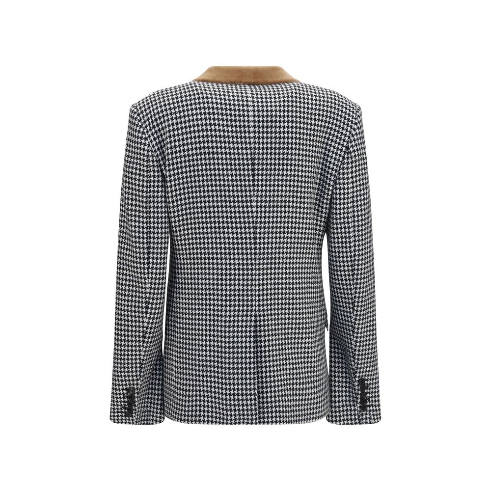 Tom Ford multicolor cashmere full-length jacket displayed on a hanger, showcasing its luxurious fabric and vibrant design.