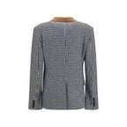 Tom Ford multicolor cashmere full-length jacket displayed on a hanger, showcasing its luxurious fabric and vibrant design.