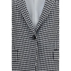 Tom Ford multicolor cashmere full-length jacket displayed on a hanger, showcasing luxurious fabric and vibrant multicolor design.