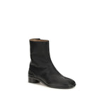 Maison Margiela black calf leather Bos Taurus ankle boots with sleek design and pointed toe.