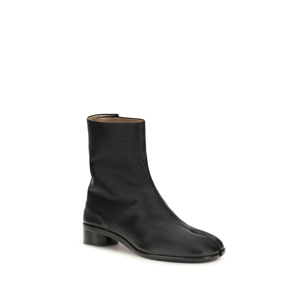 Maison Margiela black calf leather Bos Taurus ankle boots with sleek design and pointed toe.