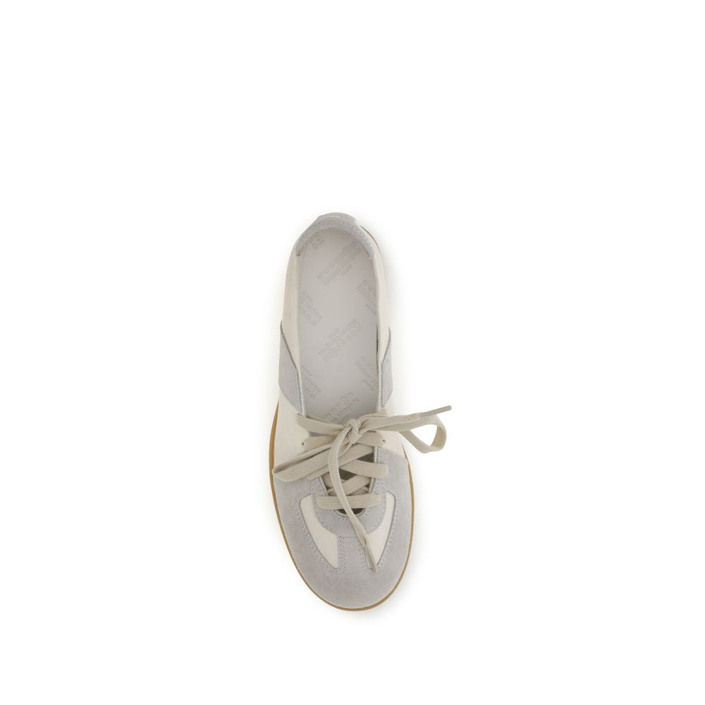 Maison Margiela beige calf leather Bos Taurus ballet flats with rounded toes and subtle stitching details.