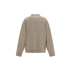 Beige cotton cardigan by Isabel Marant Étoile with a relaxed fit and button closure, displayed on a hanger.