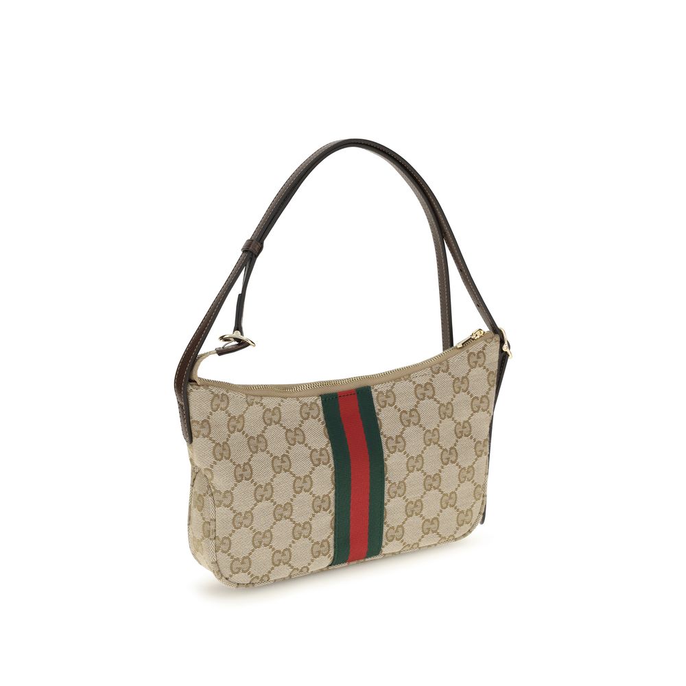 Gucci beige fabric shoulder bag with adjustable strap and gold-tone hardware, stylish accessory for everyday use.