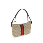 Gucci beige fabric shoulder bag with adjustable strap and gold-tone hardware, stylish accessory for everyday use.