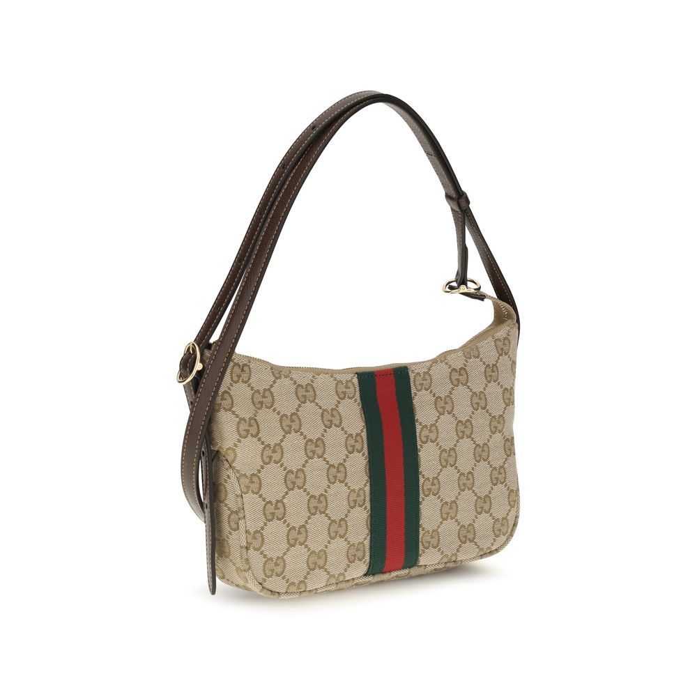 Gucci beige fabric shoulder bag with adjustable strap and subtle logo details, stylish accessory for casual or formal outfits.