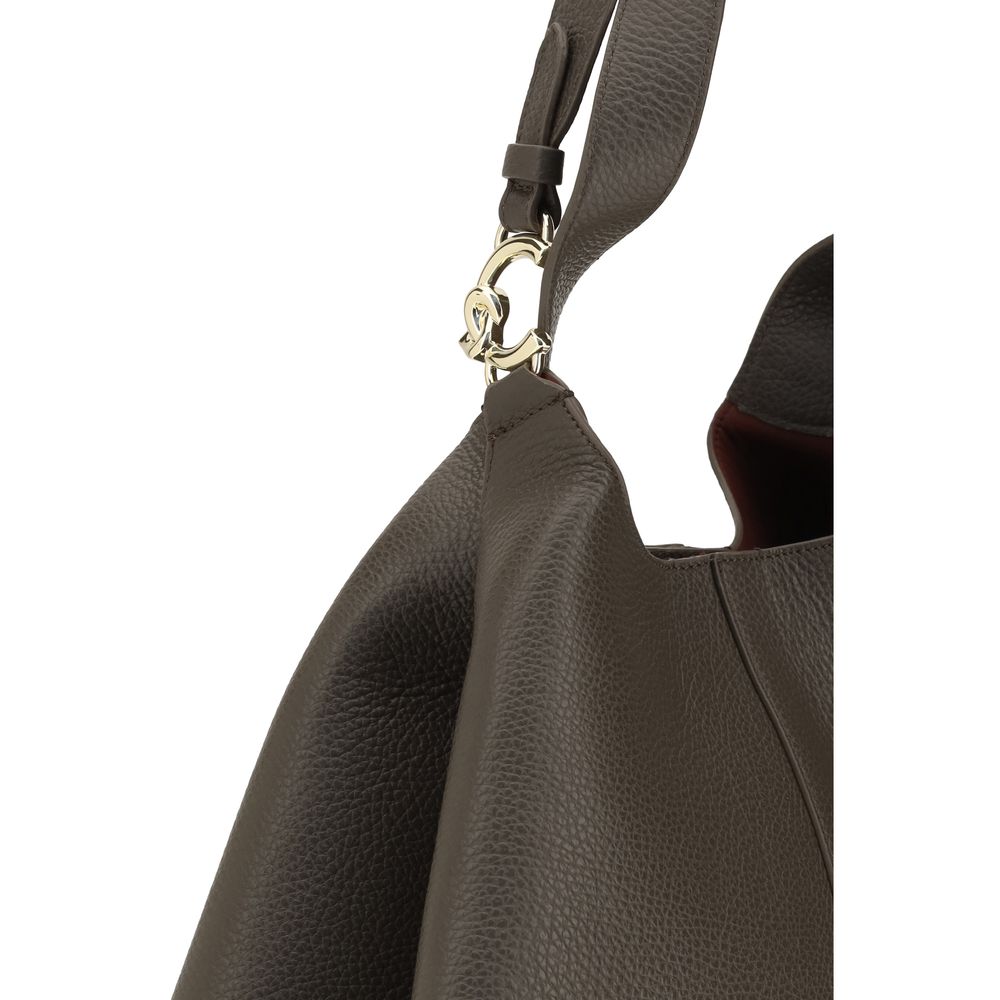 Brown calf leather Coccinelle Bos Taurus shoulder bag with sleek design and gold-tone hardware.