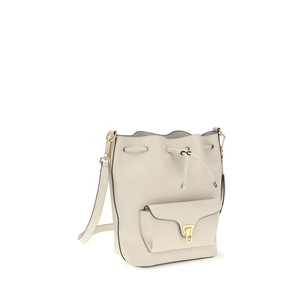 Beige calf leather Coccinelle Bos Taurus backpack bag with gold-tone hardware and adjustable straps.