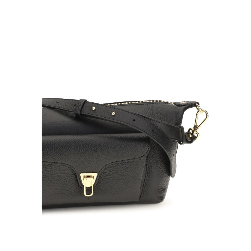Black calf leather Coccinelle Bos Taurus shoulder bag with sleek design and silver hardware, showcasing a stylish and practical accessory.