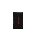 Black Virgin Wool scarf by Givenchy with a soft, luxurious texture and classic design, draped elegantly.