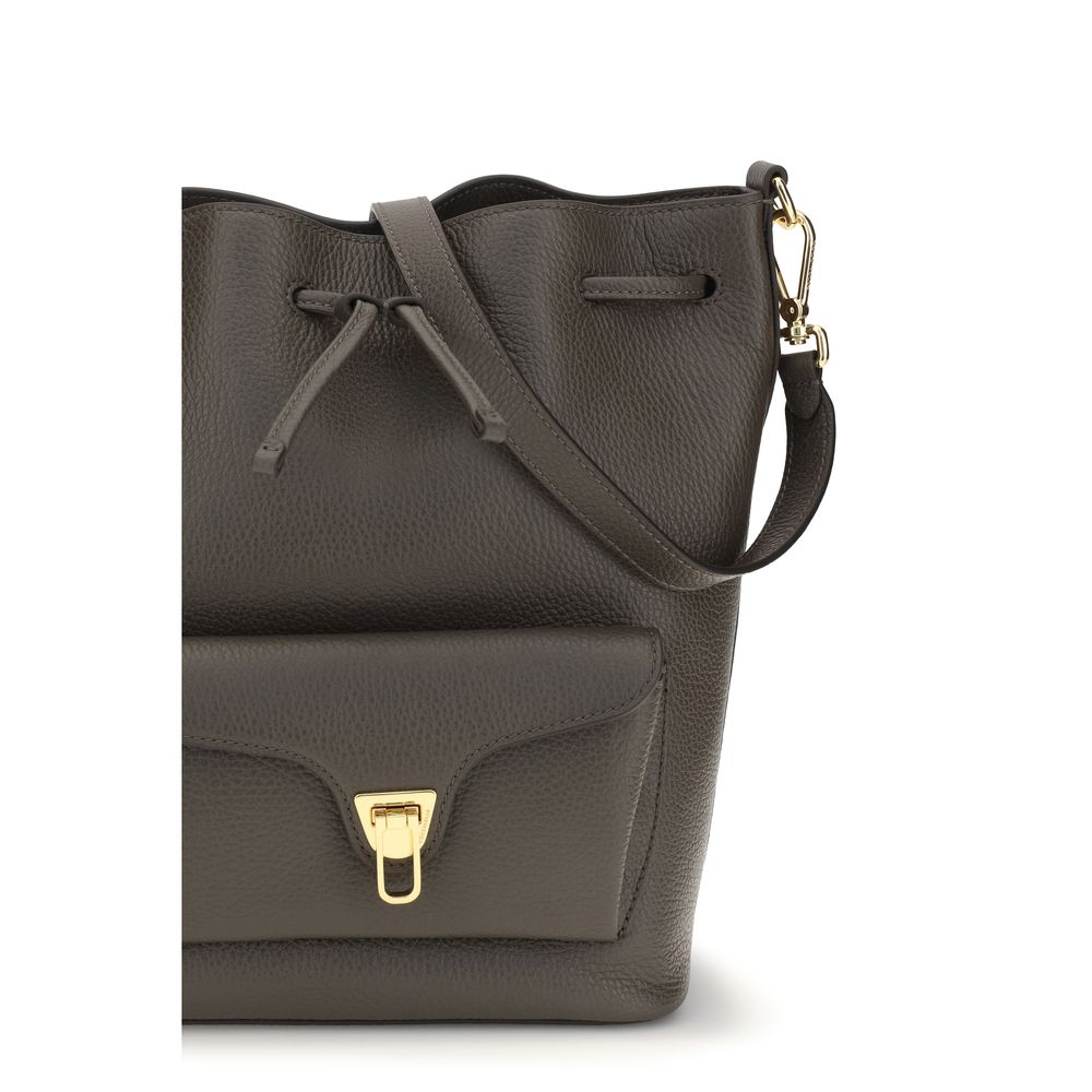 Brown calf leather Coccinelle Bos Taurus back tote bag with double handles and sleek design.