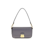 Blue calf leather Bos Taurus shoulder bag by Coccinelle with sleek design and silver hardware, shown with open top revealing interior.