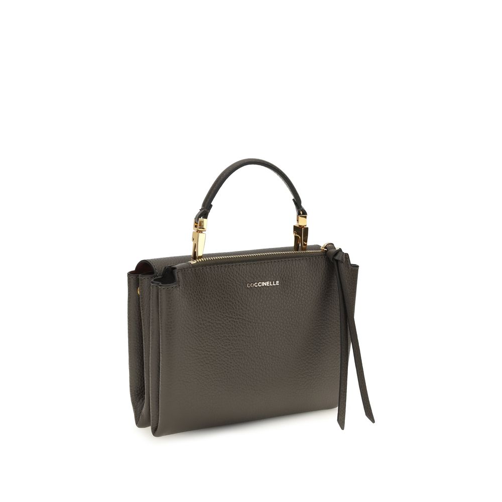 Brown calf leather Coccinelle Bos Taurus shoulder bag with sleek design and top handle, featuring subtle brand detailing.