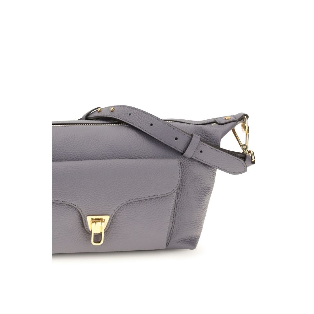 Gray calf leather Coccinelle Bos Taurus shoulder bag with sleek design and subtle brand details, perfect for stylish everyday use.