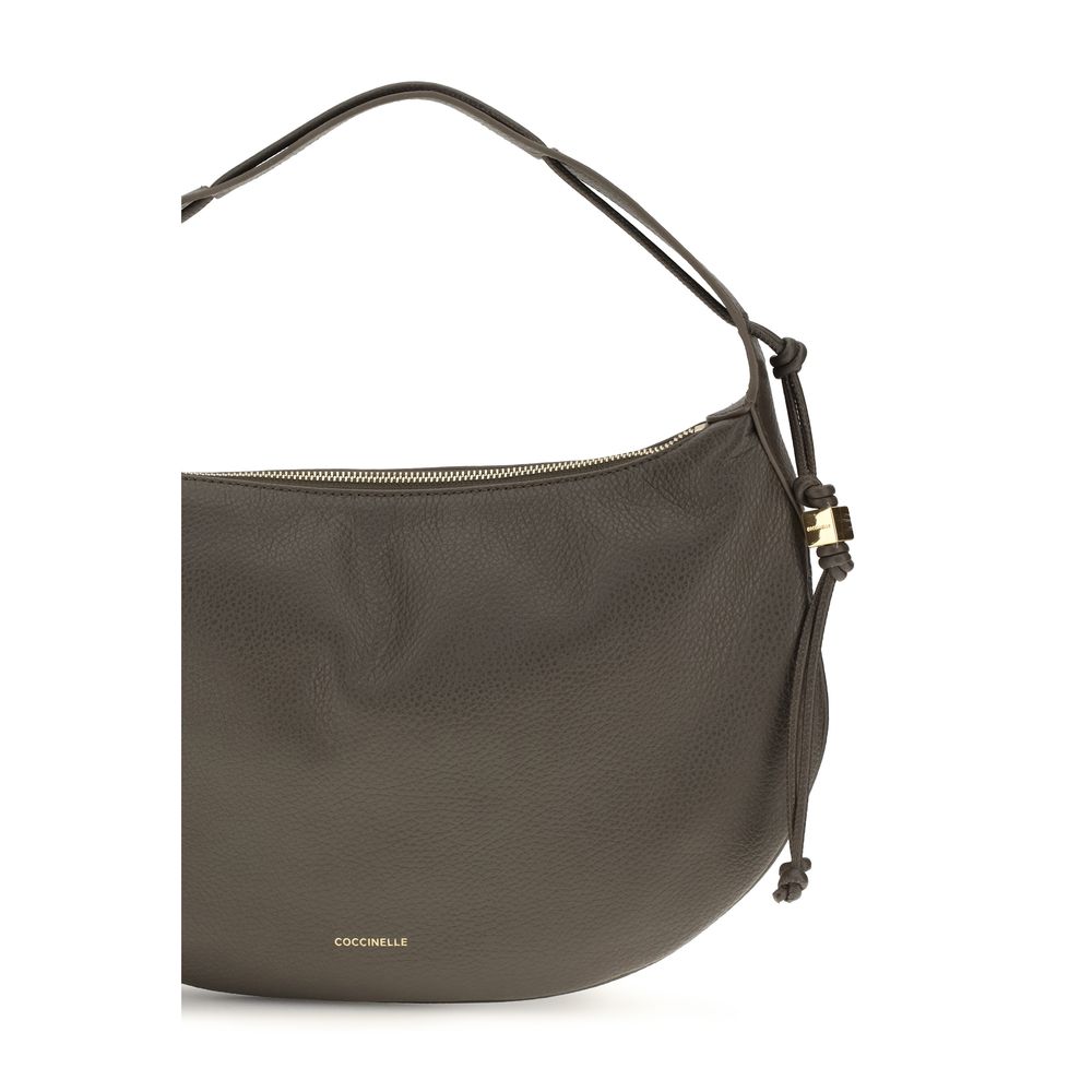Coccinelle brown calf leather Bos Taurus shoulder bag with sleek design and silver hardware, displayed against a neutral background.