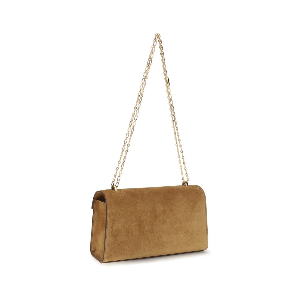 Savette brown calf leather Bos Taurus clutch bag with sleek design and compact size, featuring a smooth texture and subtle stitching.