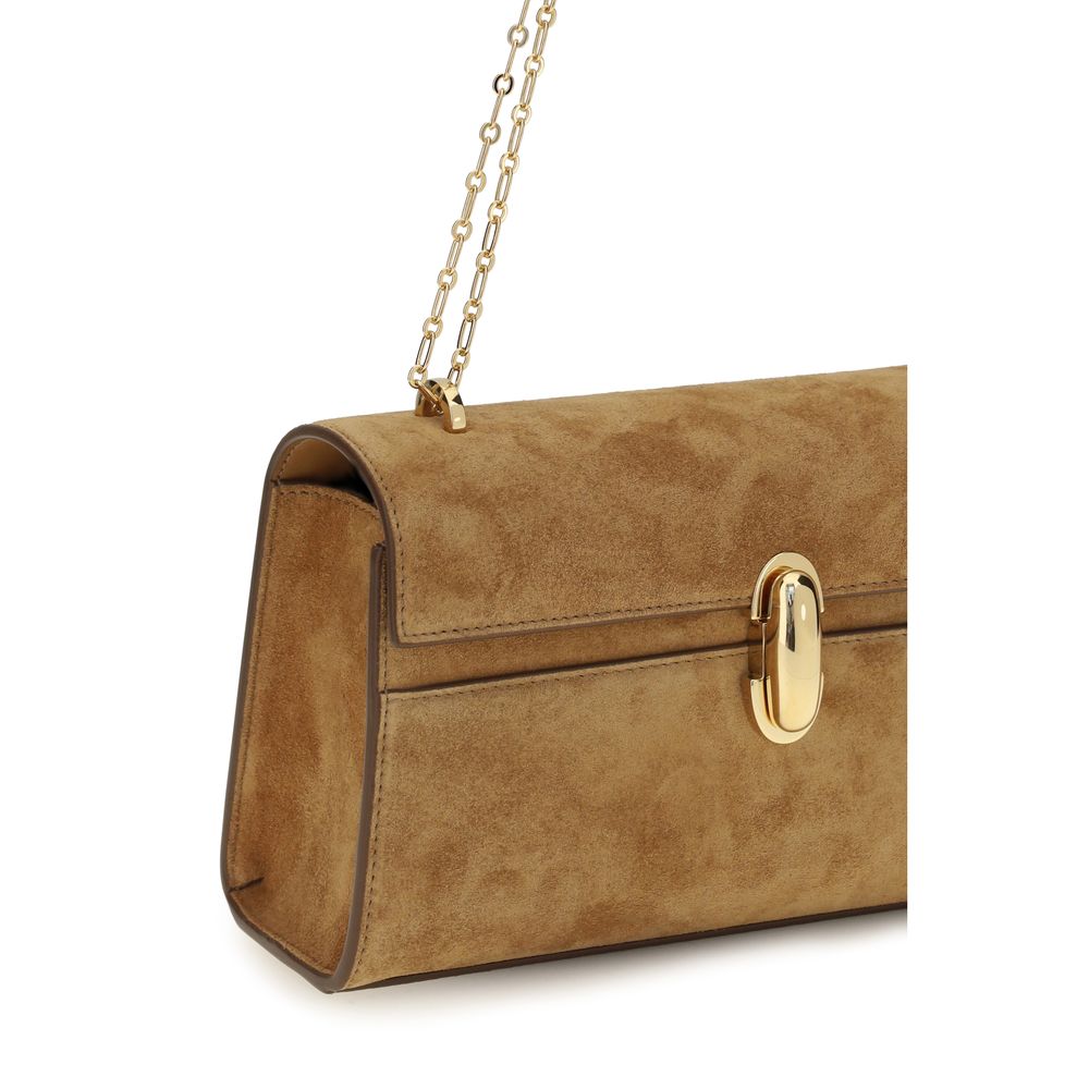 Savette brown calf leather Bos Taurus clutch bag with sleek design and minimalist style, featuring a compact rectangular shape.