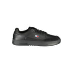 Tommy Hilfiger black polyurethane men's sneaker with sleek design and white sole, showcasing the stylish athletic footwear.