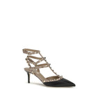 Black calf leather Valentino Garavani Bos Taurus mid heel pumps with sleek design and elegant silhouette.