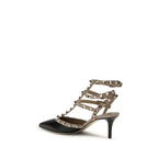 Valentino Garavani black calf leather Bos Taurus mid heel pumps with sleek design and rounded toe for elegant style.