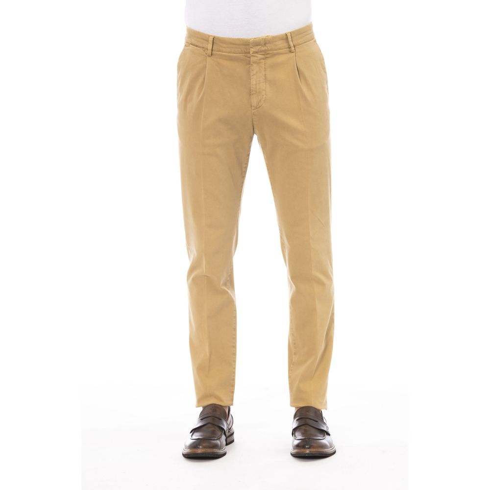Beige cotton men's pants by Peserico, tailored fit with classic design, shown on a model with side pockets and belt loops.