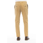 Beige cotton men's pants by Peserico featuring a tailored fit and classic design, shown on a model.