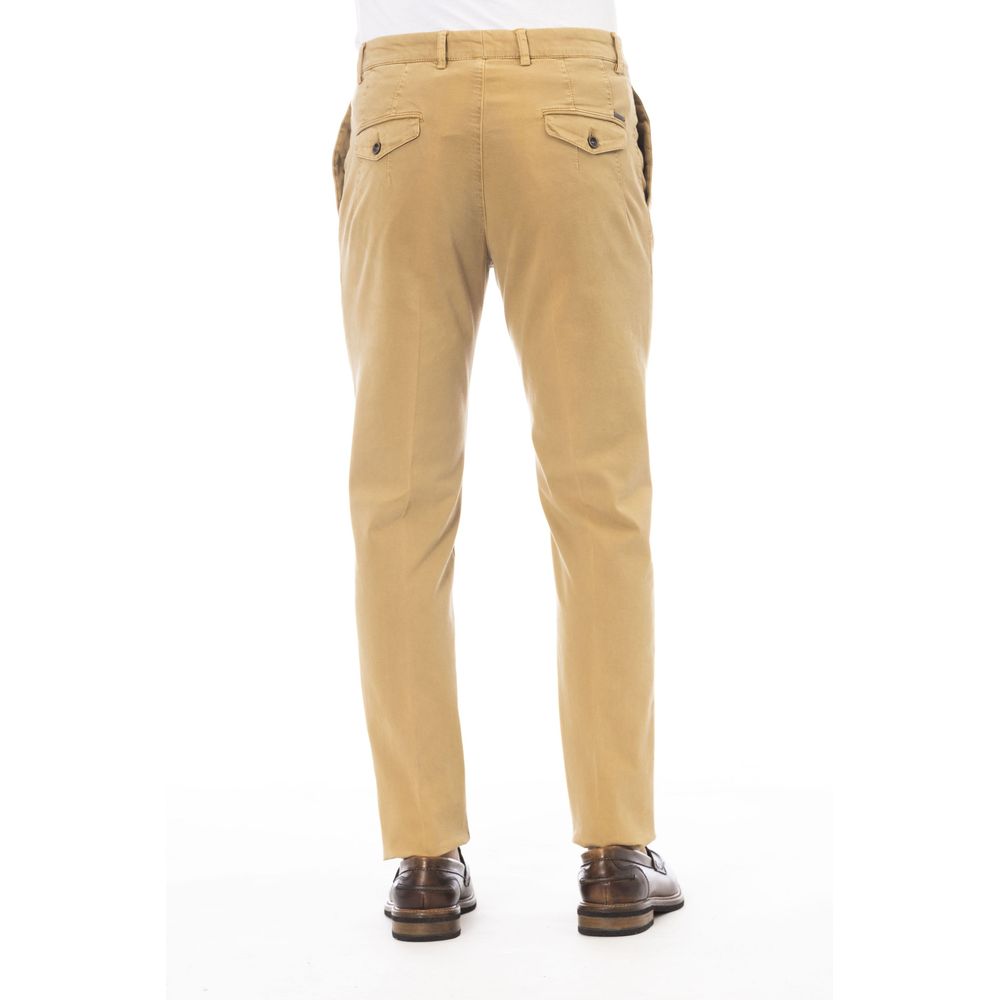 Beige cotton men's pants by Peserico featuring a tailored fit and classic design, shown on a model.