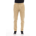 Beige cotton men's pants by Peserico, featuring a tailored fit and classic design, shown on a model.