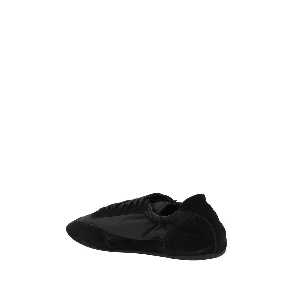 Prada black calf leather Bos Taurus athletic sneakers with sleek design and lace-up closure.