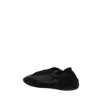 Prada black calf leather Bos Taurus athletic sneakers with sleek design and lace-up closure.