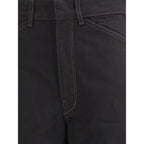 Black cotton casual pants by Lemaire, featuring a relaxed fit and minimalist design, shown on a model.