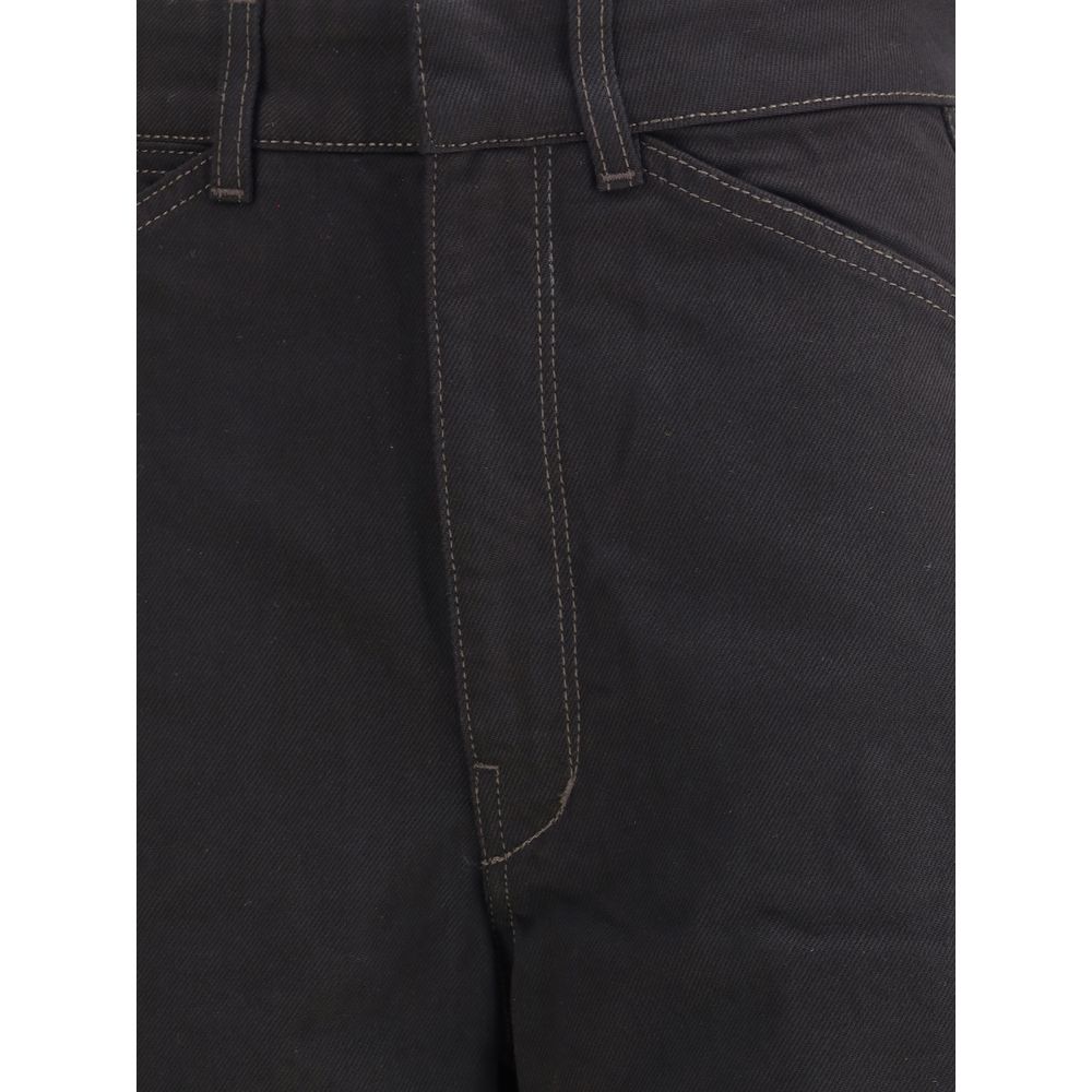 Black cotton casual pants by Lemaire, featuring a relaxed fit and minimalist design, shown on a model.