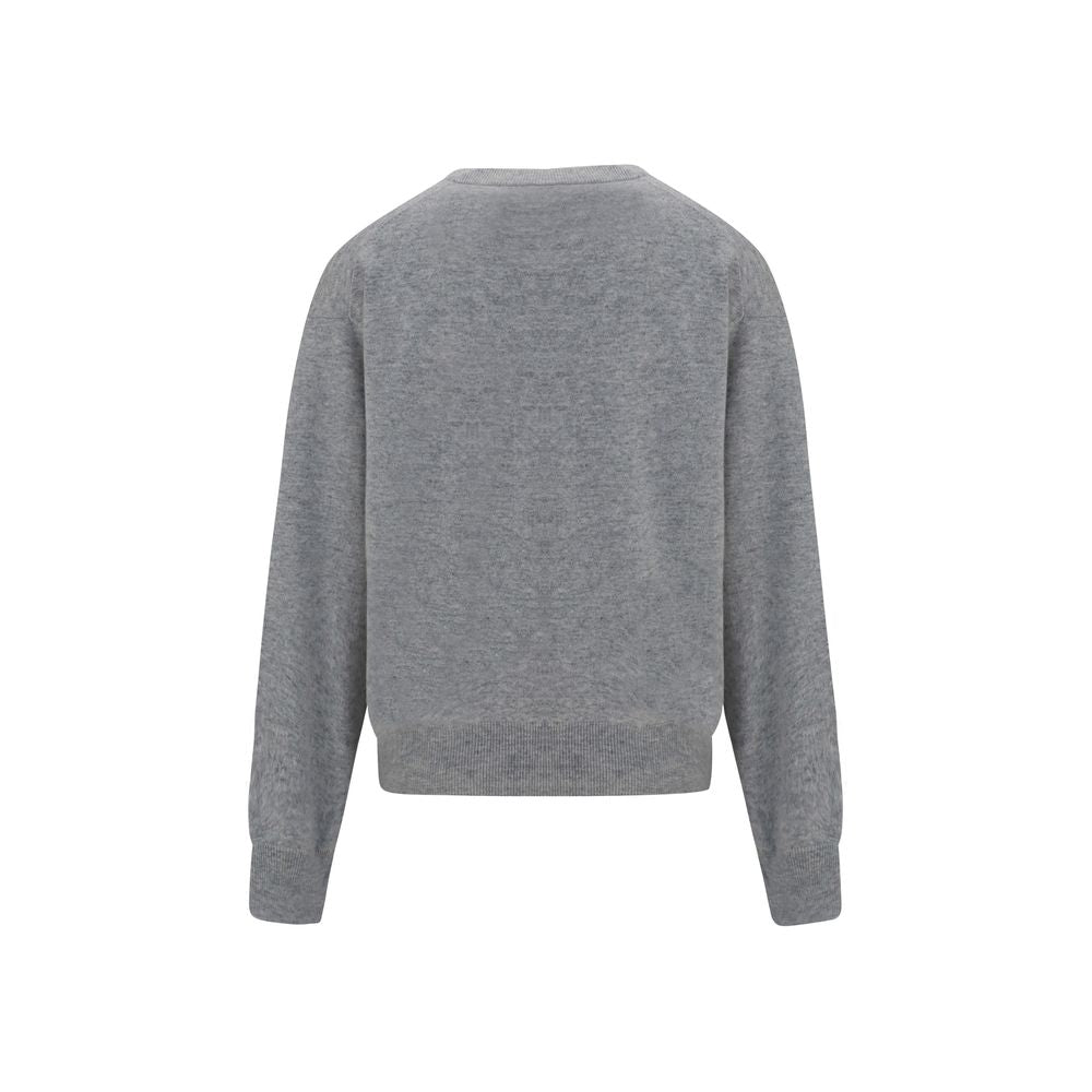 Brunello Cucinelli gray cashmere sweater displayed on a hanger, showcasing soft, luxurious knit fabric and classic style.
