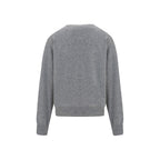 Brunello Cucinelli gray cashmere sweater displayed on a hanger, showcasing soft, luxurious knit fabric and classic style.