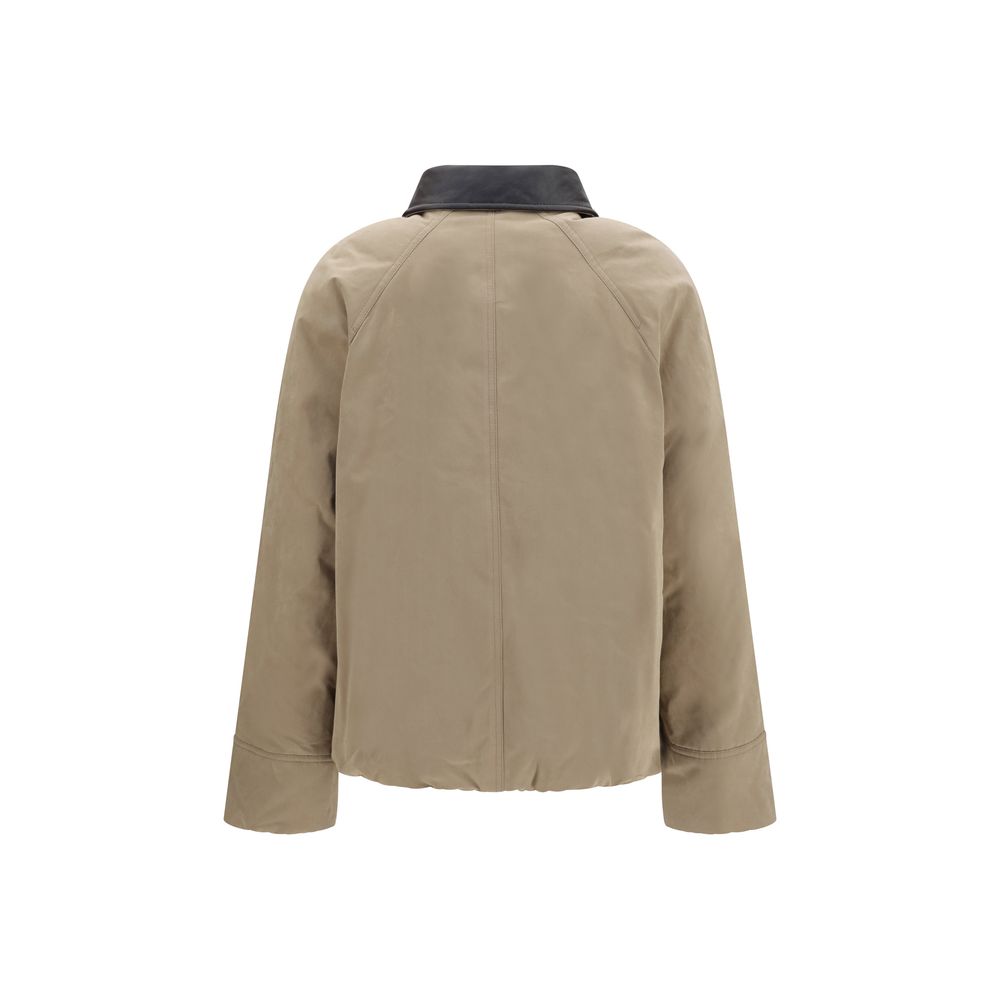 Beige Brunello Cucinelli cotton full-length jacket displayed on a hanger, showcasing the sleek, tailored design and high-quality fabric.